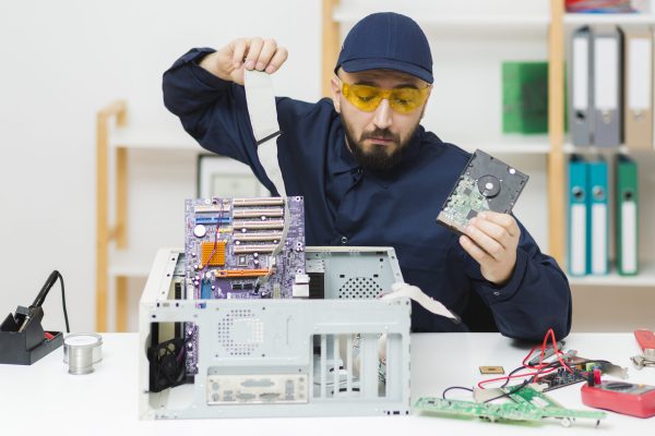 front-view-man-repairing-computer
