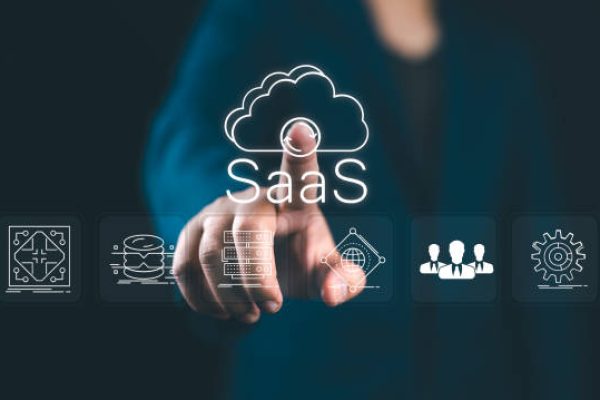 SaaS, software as a service concept. Businessman touching cloud SaaS icon on virtual screen. software services on cloud system. Internet and networking technology.