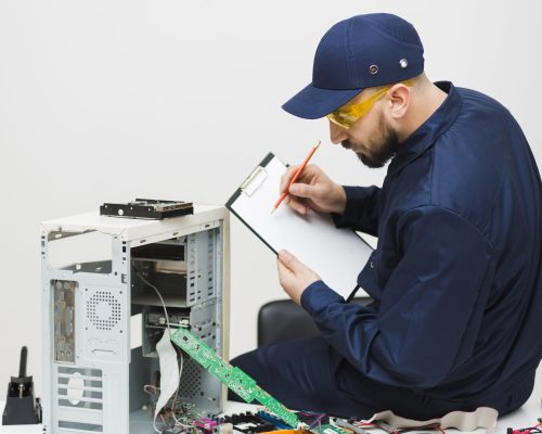 sideways-man-repairing-computer